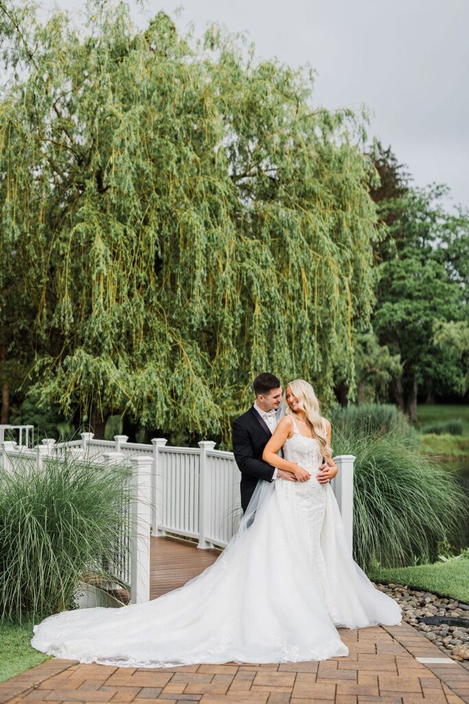 Newlyweds embrace at outdoor Long Island wedding venue